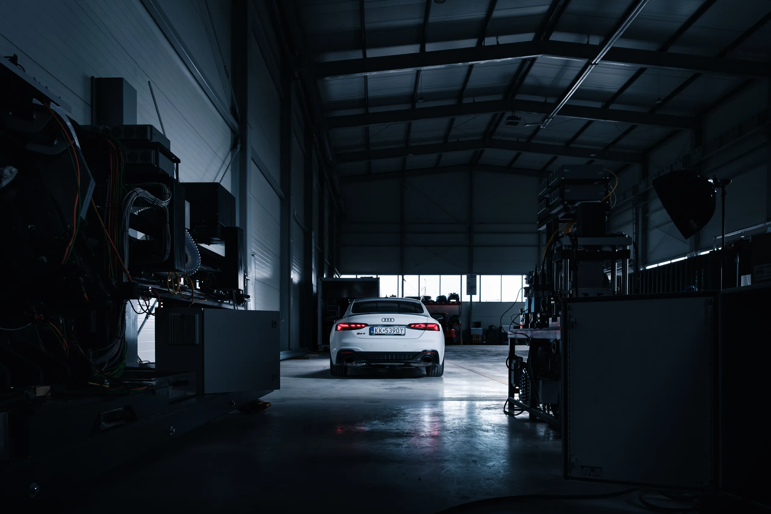 White Audi RS5 rear, warehouse
