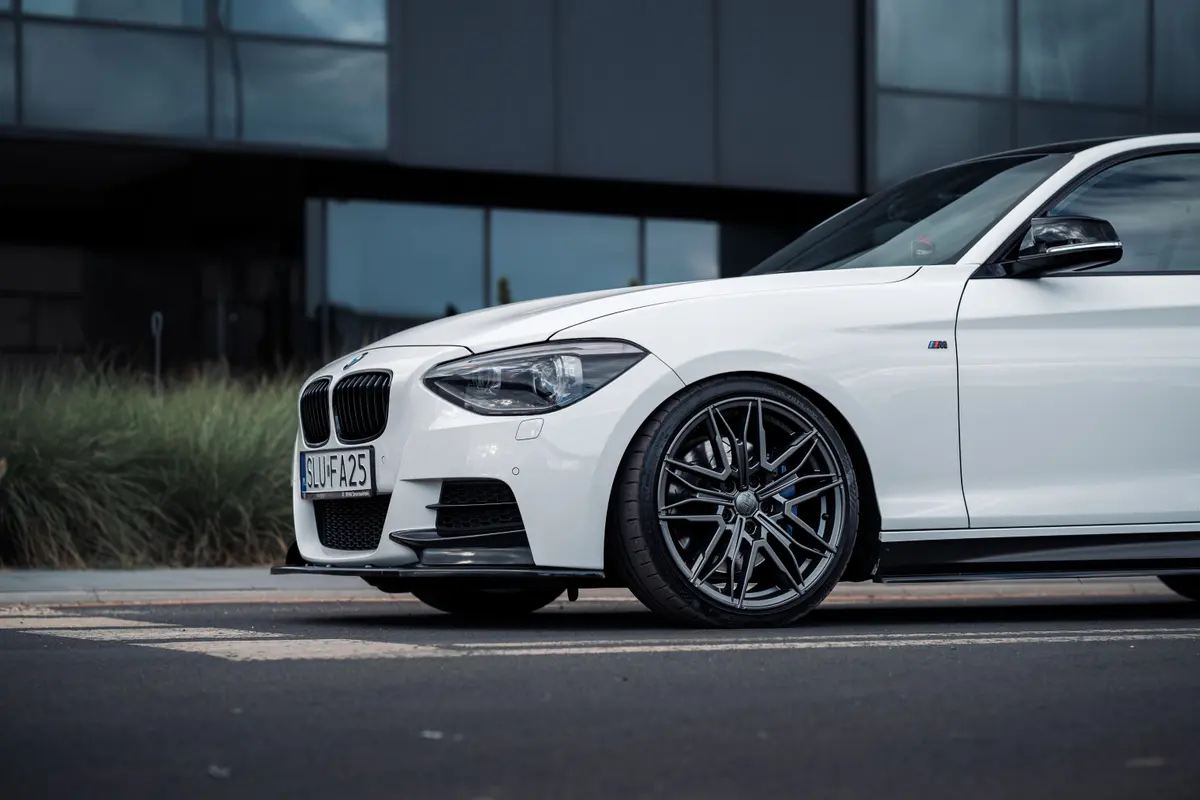 White BMW 1 Series, front wheel and splitter detail